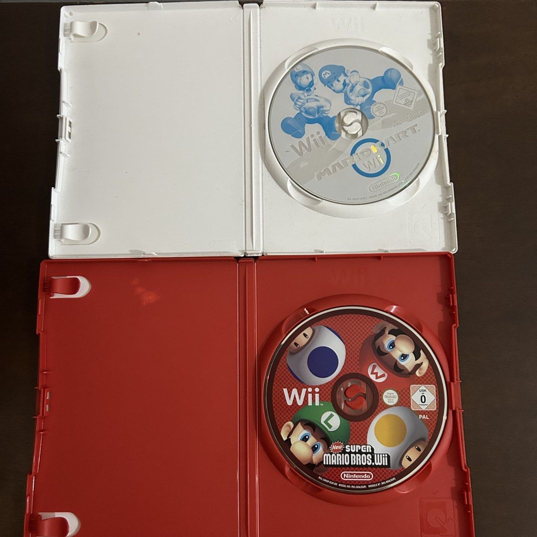 Mario Kart & Super Mario Bros Wii Bundle (Category: Nintendo) located in Quezon City. Submitted by argamenest (Listing ID 1461385806, Image 3). Description: - tested and working - English EUR PAL - take all for 1300Only 📍 Fairview Quezon City.