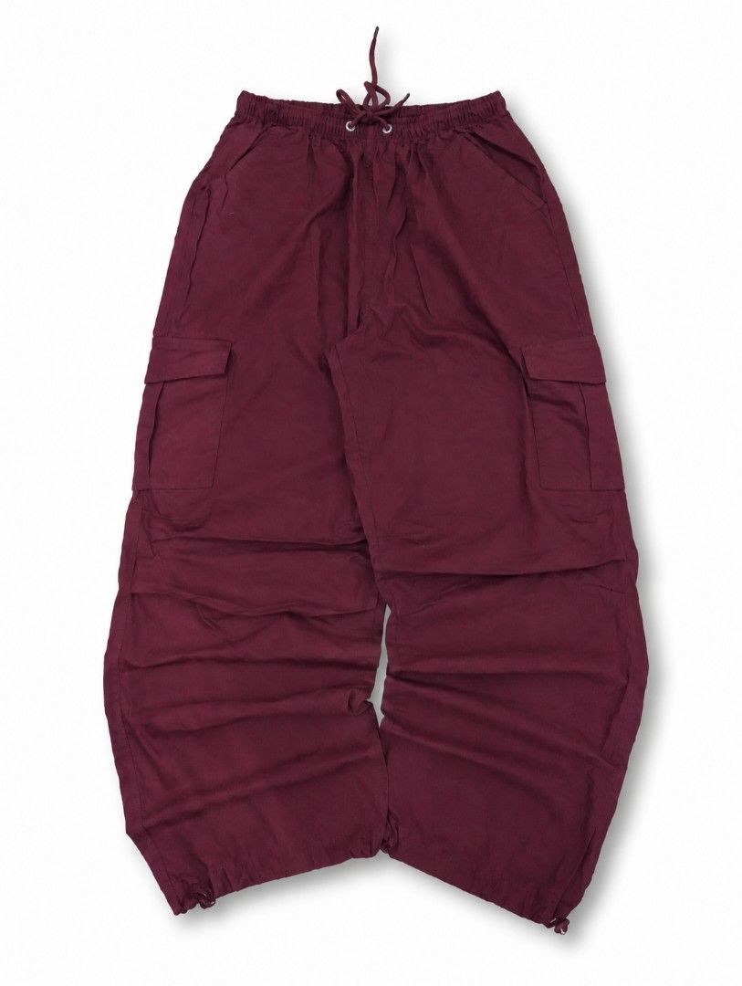 Maroon Cargo Pants with Drawstring Waist (Category: Other Bottoms) located in General Mariano Alvarez. Submitted by jheysezikiel_arce (Listing ID 1461526676, Image 1). Description: - Maroon cargo pants - Elastic waistband with drawstring - Multiple front and side pockets - Adjustable drawstring at ankles - Loose, comfortable fit.