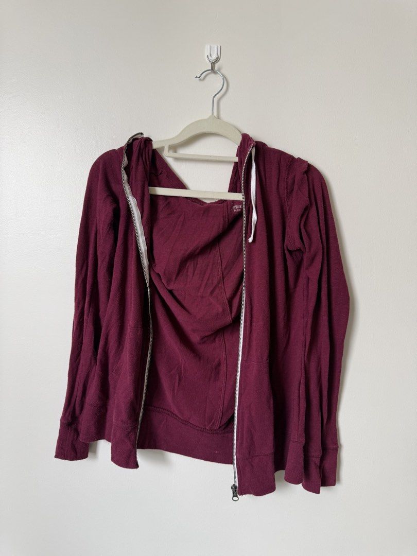 Maroon Zip-Up Jacket (Category: Hoodies) located in Pasig City. Submitted by yensyard__ (Listing ID 1461380859, Image 3). Description: - Maroon zip-up hoodie - Long sleeves with hood - Two front pockets - Zipper closure - Soft fabric - Ideal for layering or casual wear.