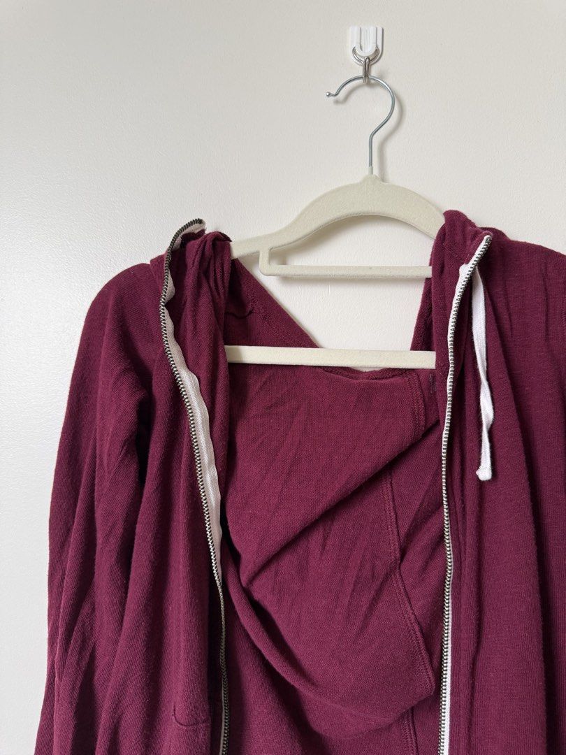 Maroon Zip-Up Jacket (Category: Hoodies) located in Pasig City. Submitted by yensyard__ (Listing ID 1461380859, Image 2). Description: - Maroon zip-up hoodie - Long sleeves with hood - Two front pockets - Zipper closure - Soft fabric - Ideal for layering or casual wear.