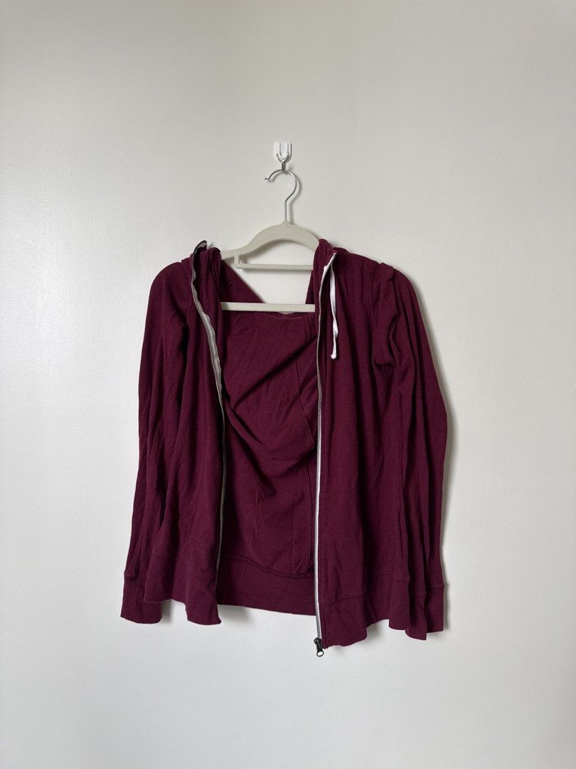 Maroon Zip-Up Jacket (Category: Hoodies) located in Pasig City. Submitted by yensyard__ (Listing ID 1461380859, Image 1). Description: - Maroon zip-up hoodie - Long sleeves with hood - Two front pockets - Zipper closure - Soft fabric - Ideal for layering or casual wear.