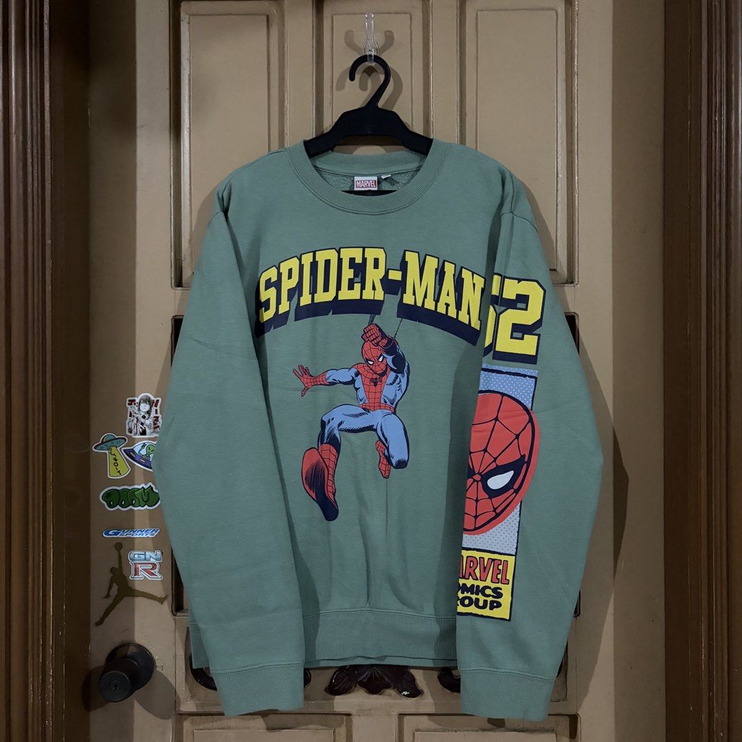 Marvel Spider-Man '62 Green Graphic Sweatshirt (Category: Coats, Jackets and Outerwear) located in Apalit. Submitted by zjiules (Listing ID 1461551963, Image 1). Description: Dimes: 23x27 L Color rate: 10/10 No issue.