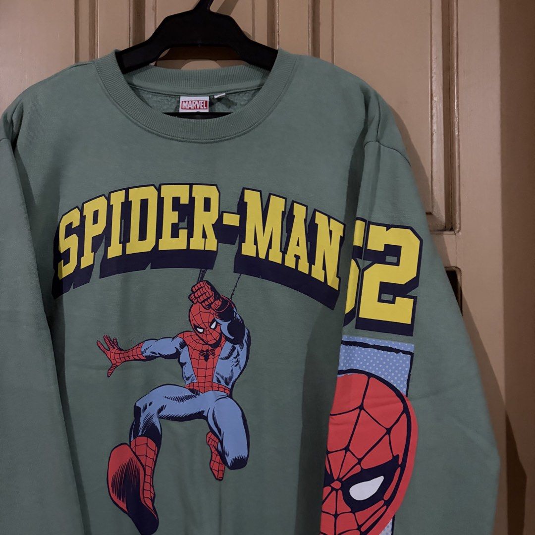 Marvel Spider-Man '62 Green Graphic Sweatshirt (Category: Coats, Jackets and Outerwear) located in Apalit. Submitted by zjiules (Listing ID 1461551963, Image 2). Description: Dimes: 23x27 L Color rate: 10/10 No issue.