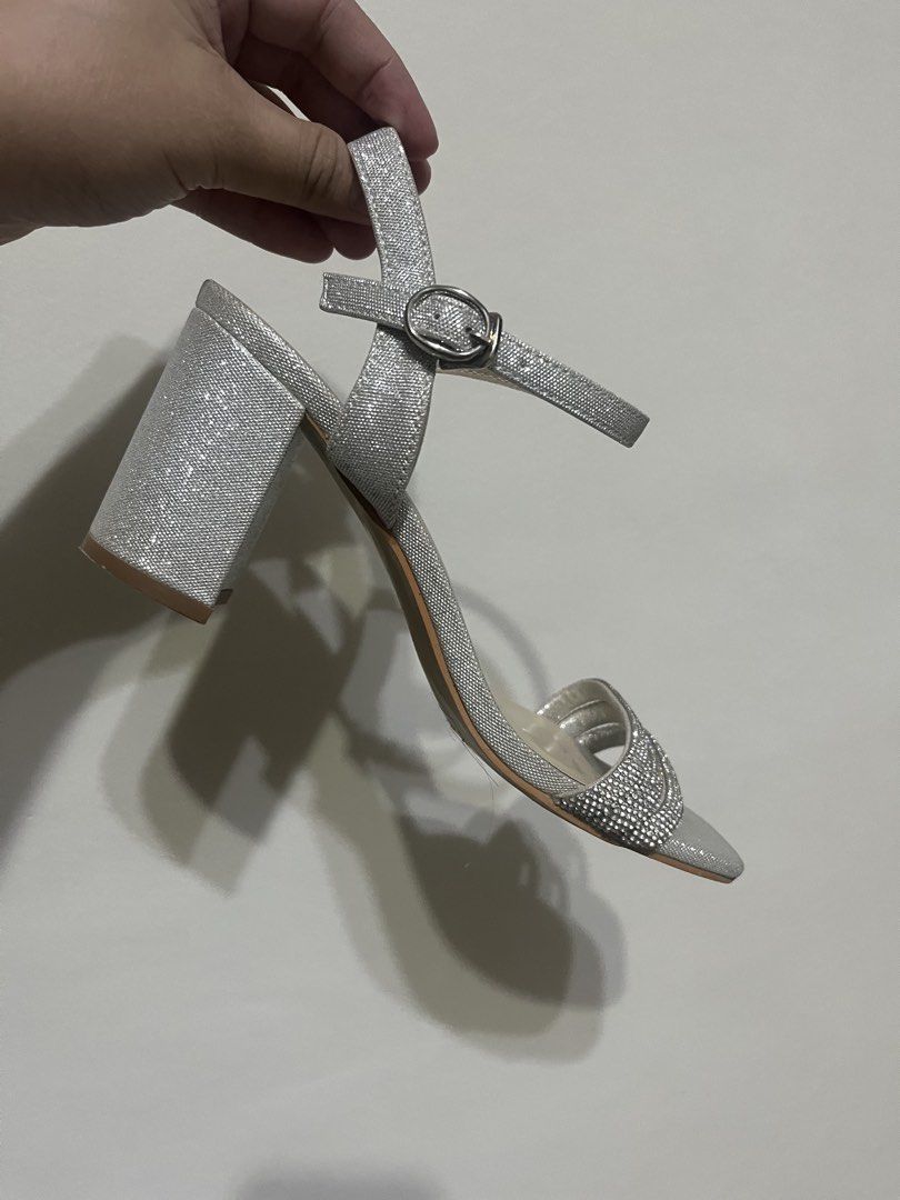 Matthews Silver Glitter Block Heels with Rhinestones (Category: Heels) located in Manila. Submitted by brightshark-0d45dd (Listing ID 1461494898, Image 2). Description: Pre-loved Matthews silver heels, worn once only during my wedding. 🤍 ✨ Size 36 ✨ Silver glitter finish ✨ Sparkly/rhinestone details ✨ Ankle strap ✨ Block heels ✨ Perfect for wedding, debut, parties & other formal occasions Condition: Worn once only. Still in good condition. May v