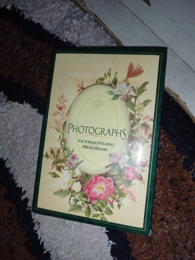 MAX Victorian Folding Photo Frame (Category: Frames & Pictures) located in Manila. Submitted by silent_vonachiles (Listing ID 1461468454, Image 1). Description: - Victorian folding photo frame by MAX - Features a charming floral and butterfly design - Can display multiple cherished photos - Folds neatly for easy storage - Adds a lovely touch to any home decor.