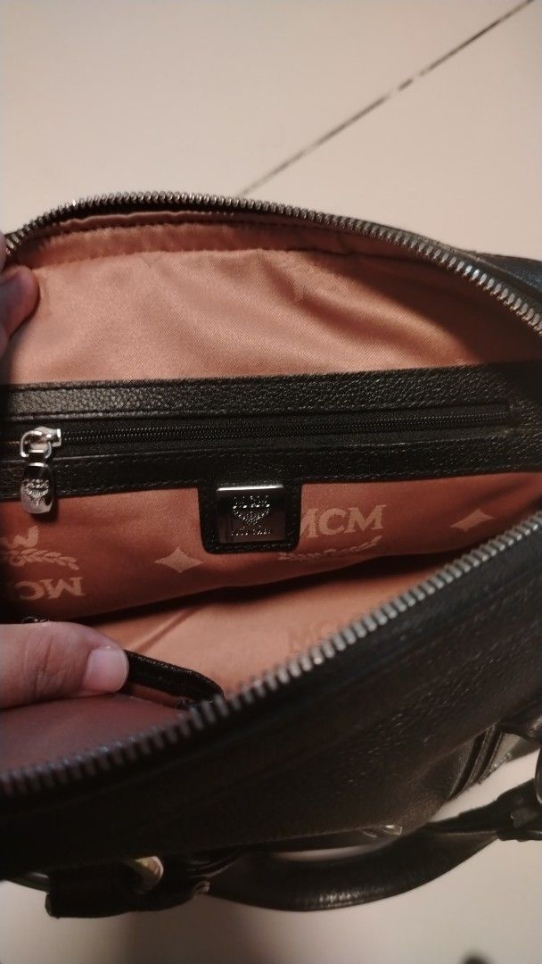 MCM Black Leather Studded Boston Bag (Category: Luxury Bags & Wallets) located in Manila. Submitted by wildwind_73f77a (Listing ID 1461501886, Image 2). Description: - Authentic black leather MCM Boston bag - Eye-catching silver hardware and all-over stud detailing - Interior MCM logo lining - Convenient interior zip pocket - Sturdy and comfortable handles - Secure zipper closure - Ideal for daily use.