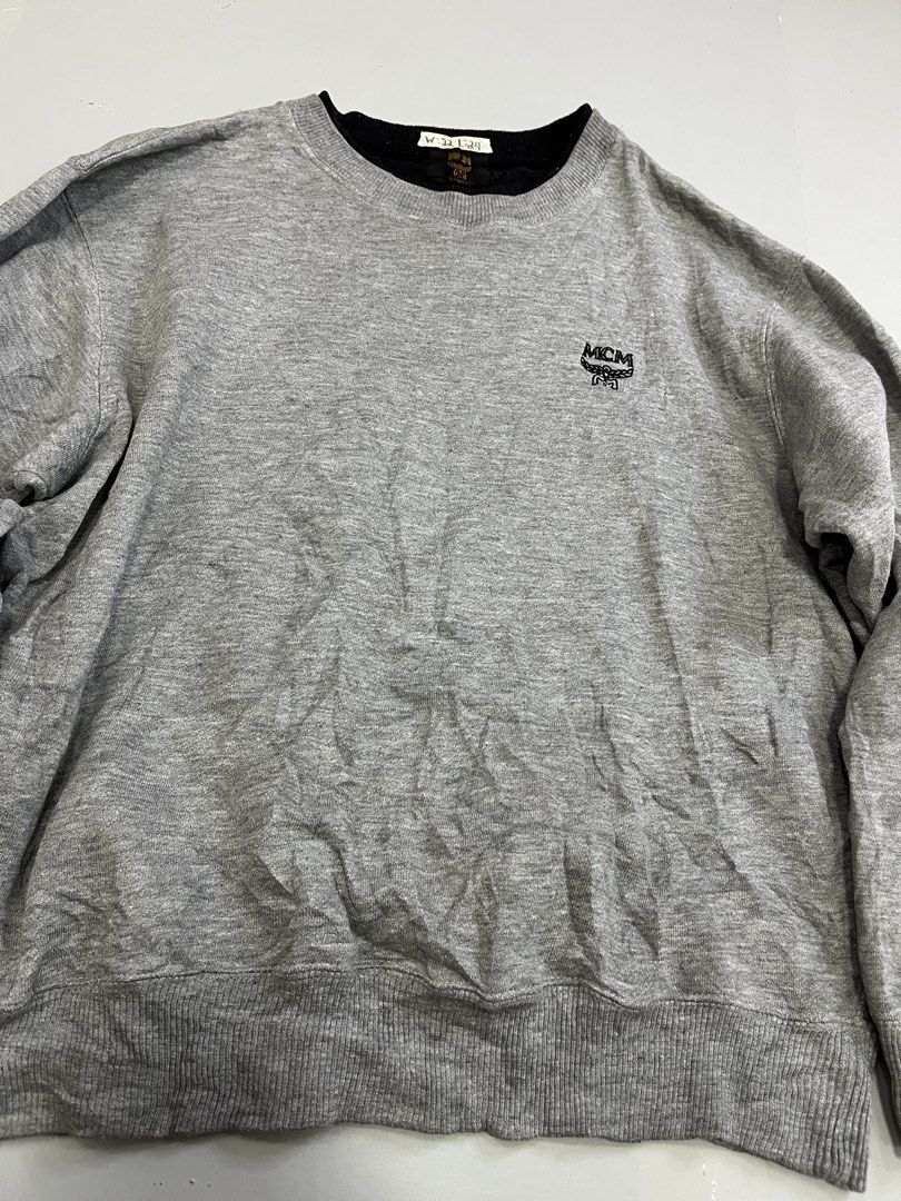 MCM Logo Sweatshirt Grey Size L (Category: Luxury Apparel) located in Mabalacat. Submitted by aas_thriftfings (Listing ID 1461492905, Image 2). Description: - Grey MCM Sweatshirt - Classic embroidered MCM logo on chest - Crew neck, long sleeves - Ribbed cuffs and hem - Tagged size L - Ideal for everyday casual wear.