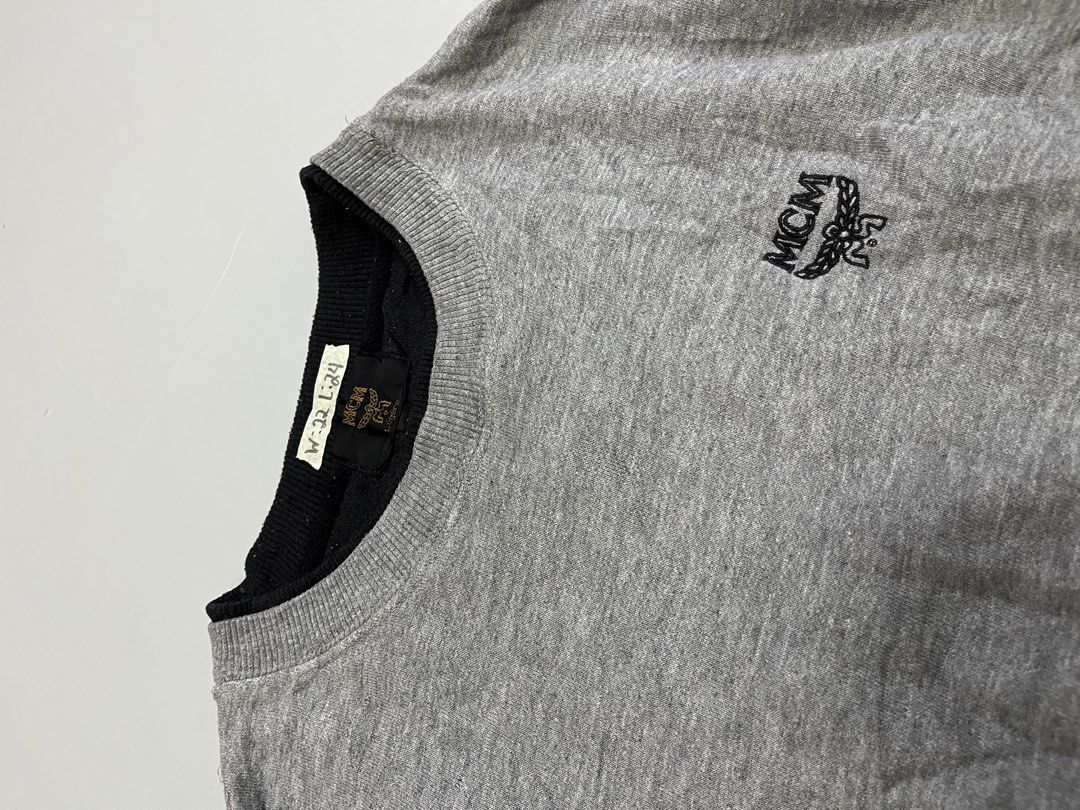 MCM Logo Sweatshirt Grey Size L (Category: Luxury Apparel) located in Mabalacat. Submitted by aas_thriftfings (Listing ID 1461492905, Image 3). Description: - Grey MCM Sweatshirt - Classic embroidered MCM logo on chest - Crew neck, long sleeves - Ribbed cuffs and hem - Tagged size L - Ideal for everyday casual wear.