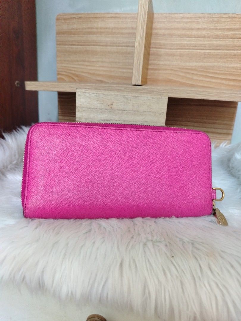 MCM Pink Studded Zip Around Wallet (Category: Luxury Bags & Wallets) located in Lucena. Submitted by gracious_chin0436 (Listing ID 1461331866, Image 2). Description: - Stylish pink MCM wallet - Accented with gold studs - Features a cute bow detail with MCM logo - Secure zip-around closure - Spacious interior for cards and cash - Ideal for everyday use Normal fo minimal sign of used kindly zoomed in pics for details .