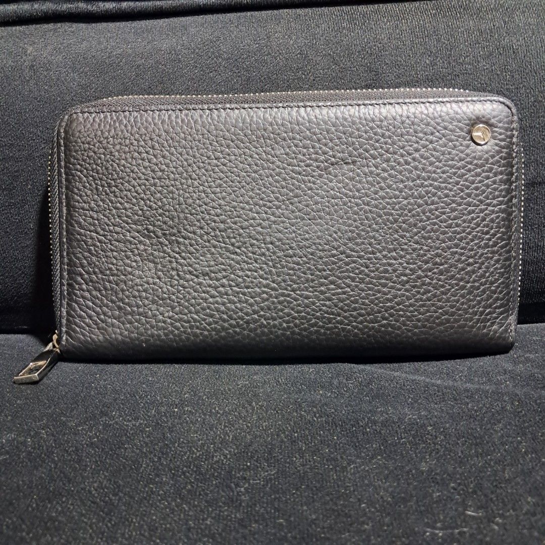 Mercedes-Benz Zip-Around Long Wallet (Category: Luxury Bags & Wallets) located in Butuan. Submitted by fabchichub (Listing ID 1461460577, Image 1). Description: This Mercedes-Benz zip-around long wallet is crafted from textured black pebbled leather, combining a minimalist design with sleek business functionality. It features a secure full-zip closure and is accented by a subtle, polished Mercedes-Benz star emblem on the upper right corner..
