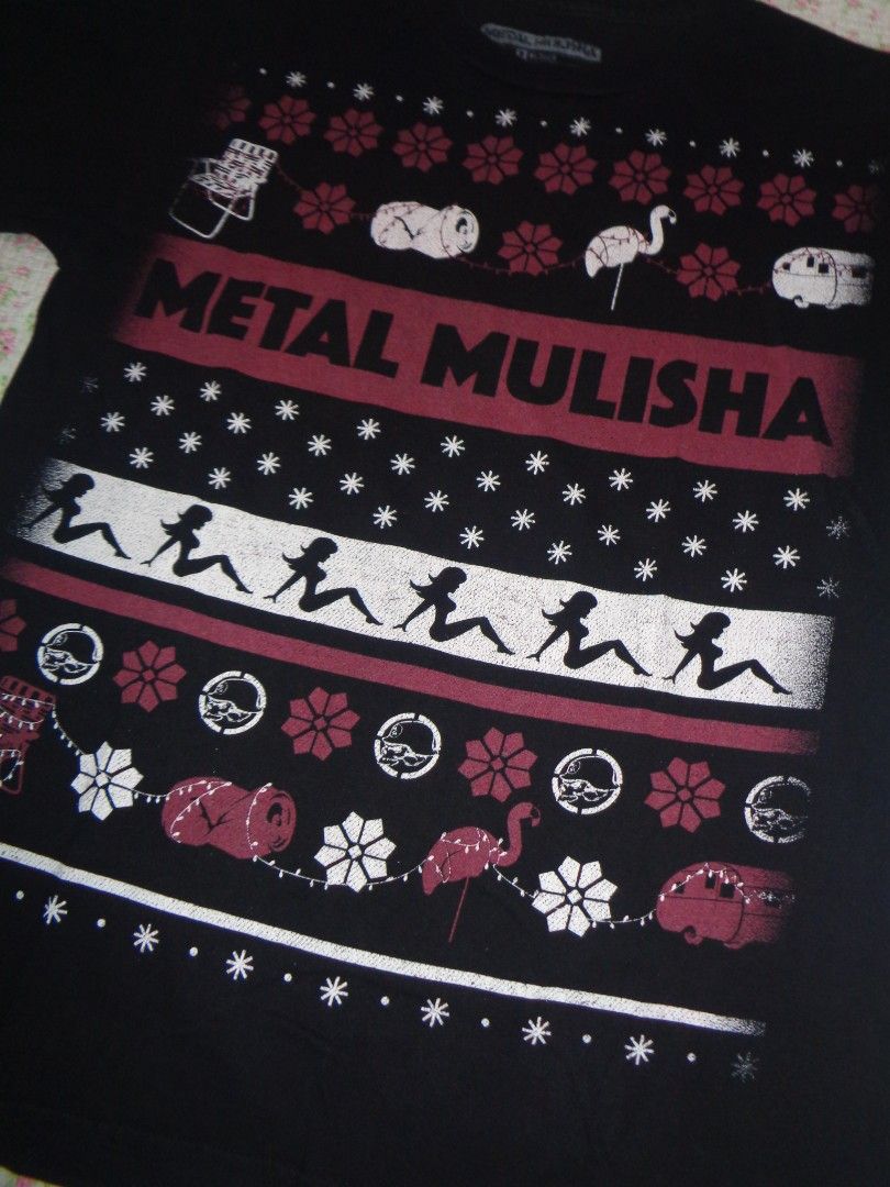 Metal Mulisha Graphic Tee (Category: Tshirts & Polo Shirts ) located in Batangas. Submitted by gelidium_lloyd (Listing ID 1461556691, Image 2). Description: - Black Metal Mulisha graphic tee - Size: Medium - Material: Cotton - Unique design featuring flamingos, campers, and pin-up style figures - Ideal for casual wear.