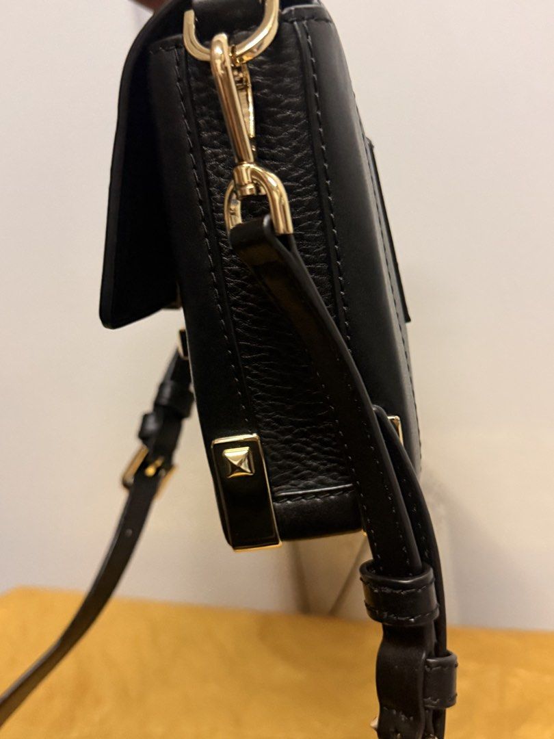 Michael Kors Black Leather Handbag with Gold Hardware (Category: Luxury Bags & Wallets) located in Zamboanga. Submitted by bags2bags2bags (Listing ID 1461404570, Image 3). Description: - Authentic Michael Kors black leather handbag - Elegant gold-tone hardware - Secure turn-lock closure with MK logo - Versatile carrying options: top handle and detachable shoulder strap - Classic design suitable for everyday or special events.