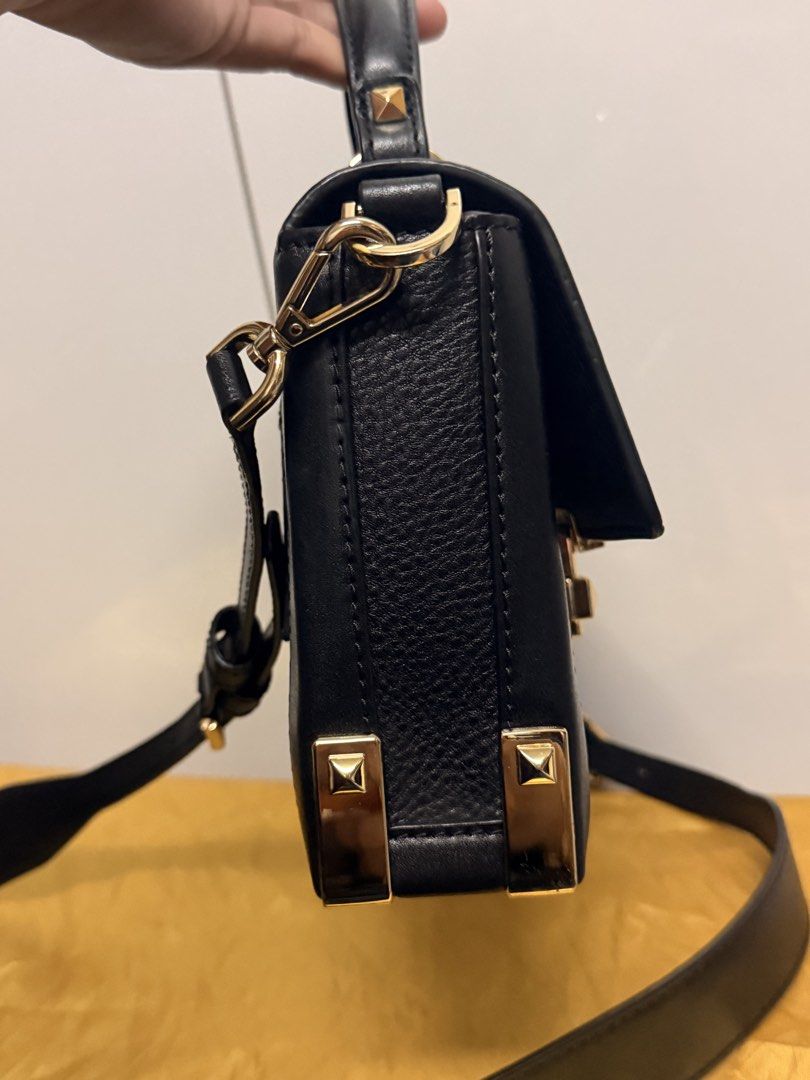 Michael Kors Black Leather Handbag with Gold Hardware (Category: Luxury Bags & Wallets) located in Zamboanga. Submitted by bags2bags2bags (Listing ID 1461404570, Image 2). Description: - Authentic Michael Kors black leather handbag - Elegant gold-tone hardware - Secure turn-lock closure with MK logo - Versatile carrying options: top handle and detachable shoulder strap - Classic design suitable for everyday or special events.