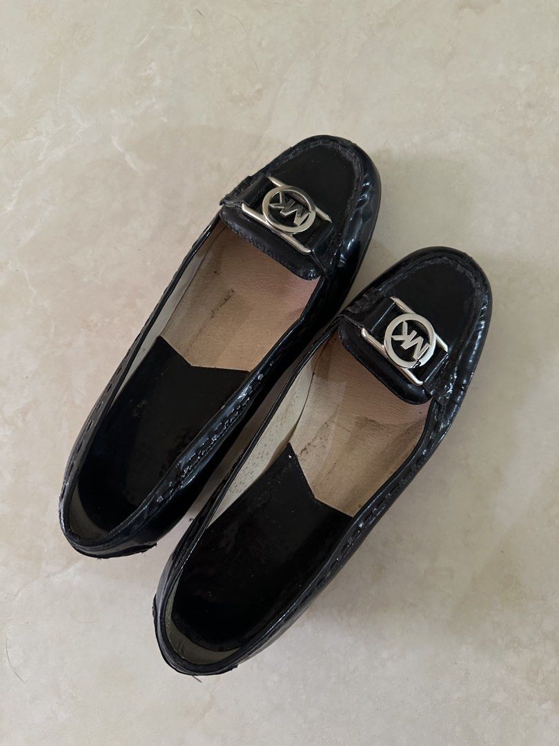 Michael Kors Black Patent Leather Loafers (Category: Loafers) located in Manila. Submitted by nasalgahan76152 (Listing ID 1461464892, Image 2). Description: Description: Selling an authentic pair of Michael Kors with signature silver MK logo hardware. Original Retail Price: ~$155 USD (approx. ₱8,500+) Price: 1800 (Cash or Gcash payment) Condition: Pre-loved. Showing normal signs of wear and gentle creasing due to age, but still has plenty of life