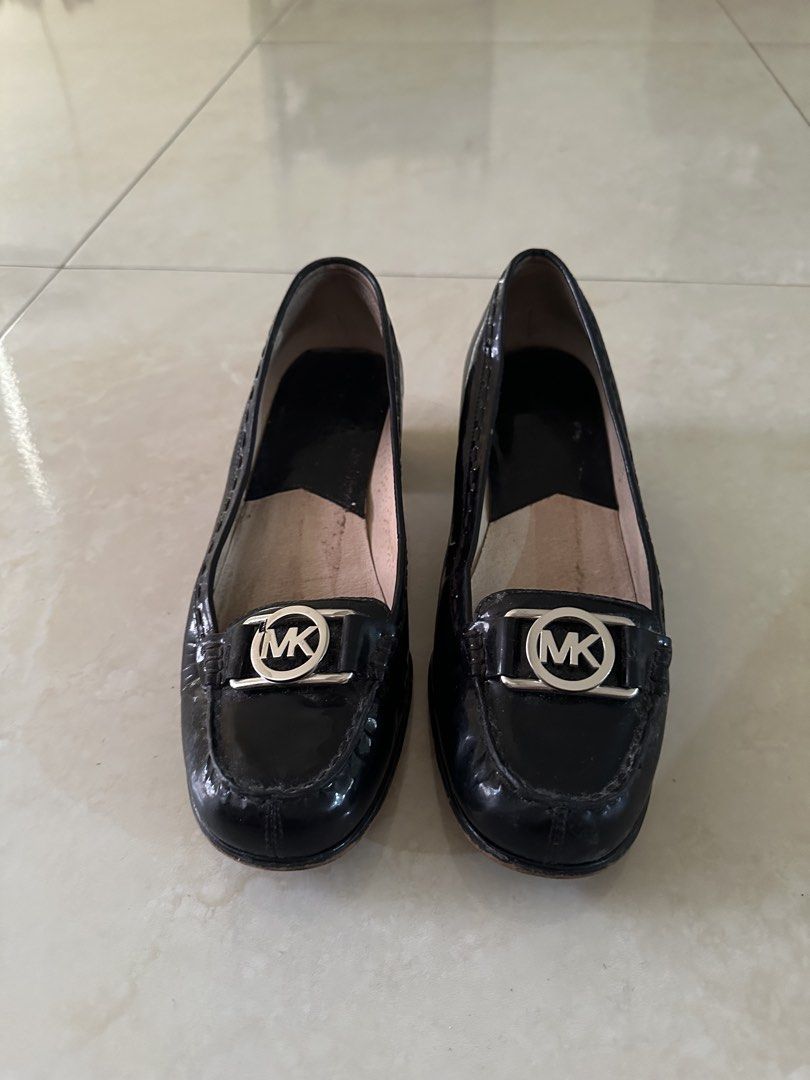 Michael Kors Black Patent Leather Loafers (Category: Loafers) located in Manila. Submitted by nasalgahan76152 (Listing ID 1461464892, Image 1). Description: Description: Selling an authentic pair of Michael Kors with signature silver MK logo hardware. Original Retail Price: ~$155 USD (approx. ₱8,500+) Price: 1800 (Cash or Gcash payment) Condition: Pre-loved. Showing normal signs of wear and gentle creasing due to age, but still has plenty of life
