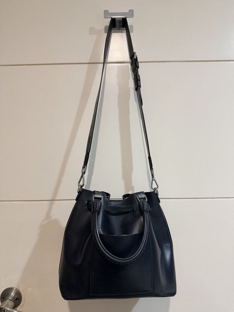 Michael Kors Blakely Black Leather Bag (Category: Luxury Bags & Wallets) located in Paranaque City. Submitted by silverforest.13 (Listing ID 1461533676, Image 2). Description: - Authentic Michael Kors Blakely black leather bucket bag. Bought this for Php18k+ from Rockwell MK store - Versatile with top handles and a detachable crossbody strap - Interior is made of soft velvet material with signs of wear and has a pocket - Shows some signs of wear 