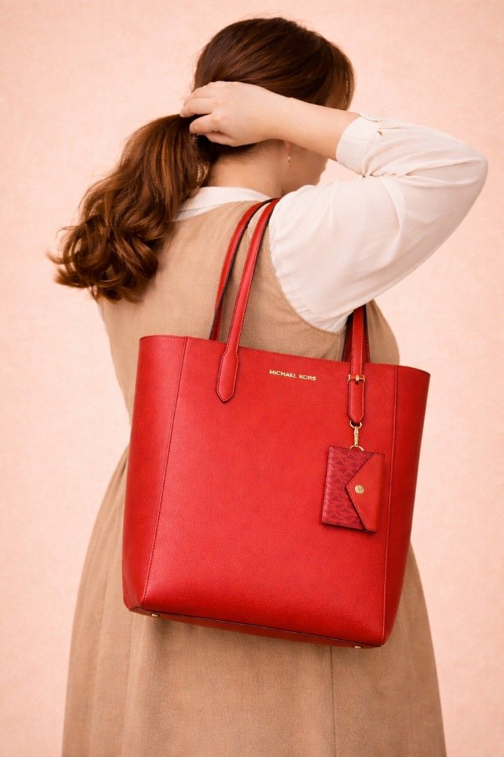 Michael Kors Tote Bag with Pouch (Category: Luxury Bags & Wallets) located in Manila. Submitted by yadordioni08067 (Listing ID 1461536750, Image 1). Description: *** Brown Sold Out*** - Michael Kors Tote Bag - Includes matching pouch - Available colors: Red, Brown, White - Ideal for everyday use - Spacious interior - Made with high-quality leather.