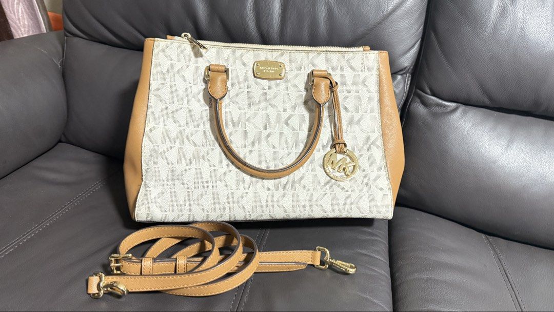 MICHAEL Michael Kors Kellen Medium Satchel Crossbody Bag (Category: Luxury Bags & Wallets) located in Mandaluyong City. Submitted by mommymee (Listing ID 1461450242, Image 1). Description: - Authentic Michael Kors bag - Signature MK print on canvas - Tan leather trim - Top zip closure - Multiple interior pockets - Detachable shoulder strap included - Gold-tone hardware -Signature Vanilla/Acorn colorway.