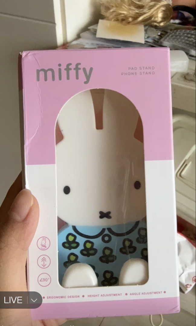Miffy Phone Stand Pad Holder (Category: Other Mobile & Gadget Accessories) located in Muntinlupa City. Submitted by irahfinds (Listing ID 1461361743, Image 2). Description: - Adorable Miffy phone stand - Adjustable with a good range of motion - Features Miffy in a blue outfit - Pink base shaped like Miffy's feet - Ideal for watching videos or video calls - Easy to set up and use.