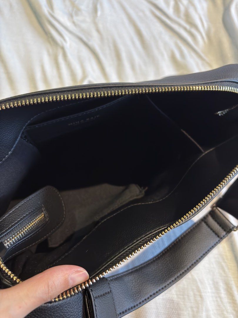Mina Baie Diaper Caddy (Category: Shoulder Bags) located in Muntinlupa City. Submitted by lovedpieces117 (Listing ID 1461381506, Image 3). Description: - Brand: Mina Baie - Material: Black Vegan Leather - Closure: Gold Zipper - Interior: Multiple compartments - Strap: Adjustable - Style: Clean, simple, great for everyday use - RFS Decluttering SRP 7,400 Payment: GCash, BPI, BDO.