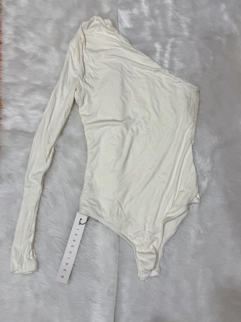 Missguided Cream One Shoulder Long Sleeve Bodysuit (Category: Others Tops) located in Legazpi City. Submitted by lezarellesque (Listing ID 1461438231, Image 1). Description: Fabric’s so soft! Still brand new with tags Please read :)) 1. Kindly refrain from asking for when worn photos. I will include them in the listing if I have, or if I was able to get one from the product website, like this photo here. 2. Last price posted as I bought these at 