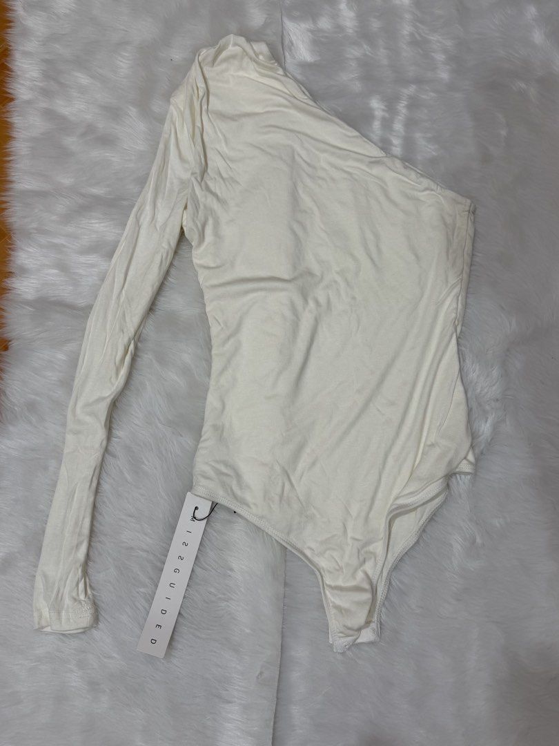 Missguided Cream One Shoulder Long Sleeve Bodysuit (Category: Others Tops) located in Legazpi City. Submitted by lezarellesque (Listing ID 1461438231, Image 3). Description: Fabric’s so soft! Still brand new with tags Please read :)) 1. Kindly refrain from asking for when worn photos. I will include them in the listing if I have, or if I was able to get one from the product website, like this photo here. 2. Last price posted as I bought these at 