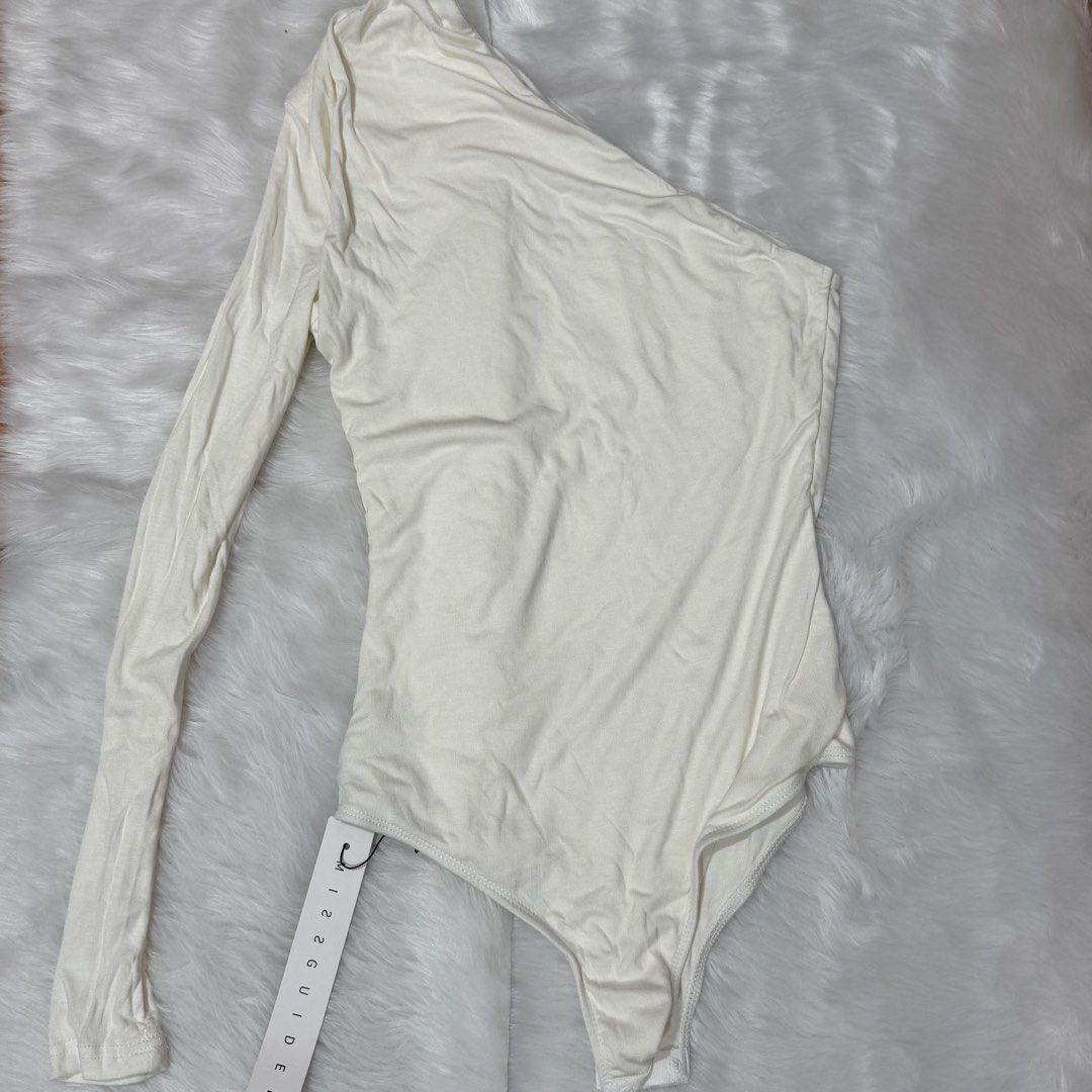 Missguided Cream One Shoulder Long Sleeve Bodysuit (Category: Others Tops) located in Legazpi City. Submitted by lezarellesque (Listing ID 1461438231, Image 2). Description: Fabric’s so soft! Still brand new with tags Please read :)) 1. Kindly refrain from asking for when worn photos. I will include them in the listing if I have, or if I was able to get one from the product website, like this photo here. 2. Last price posted as I bought these at 