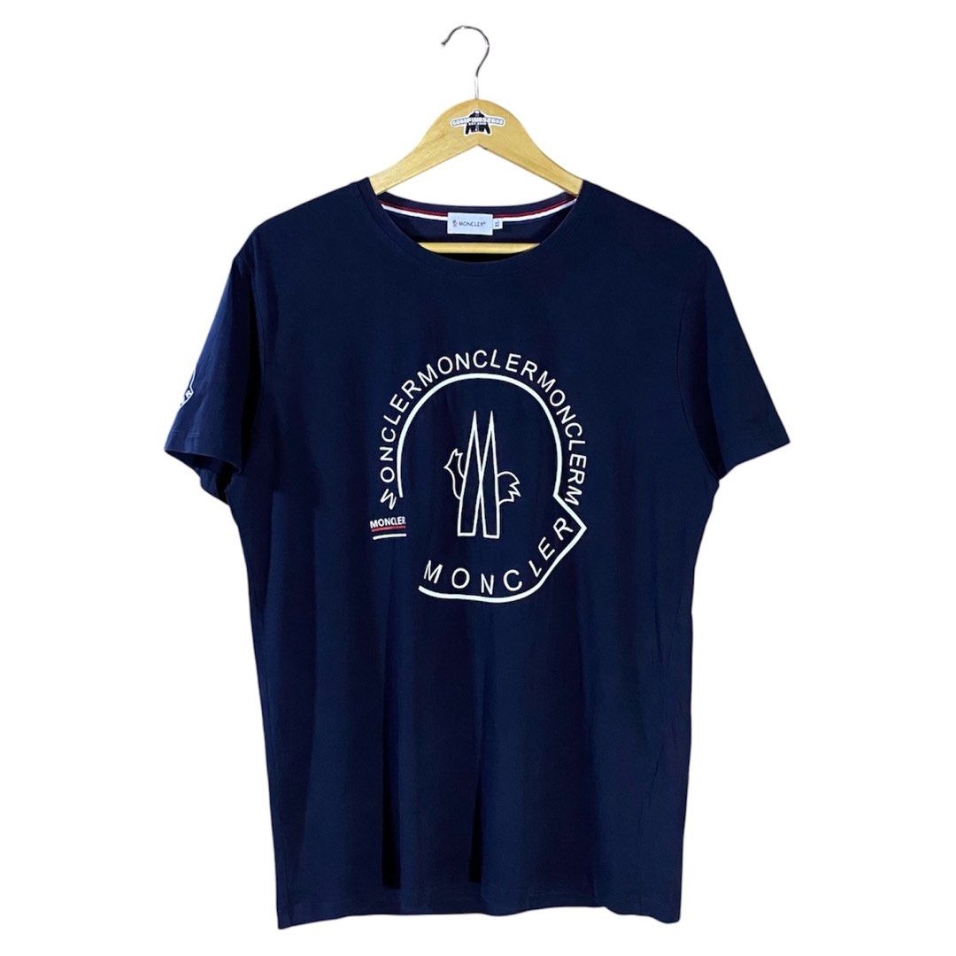 Moncler Shirt (Category: Tshirts & Polo Shirts ) located in Baguio. Submitted by goodfinds2600v2 (Listing ID 1461517937, Image 1). Description: Size on tag: XL fits M-L Dimensions: L-28 W/Bust-21.5 Description: unisex Condition: Very good Issue/s: print cracks, light discoloration on neckline .