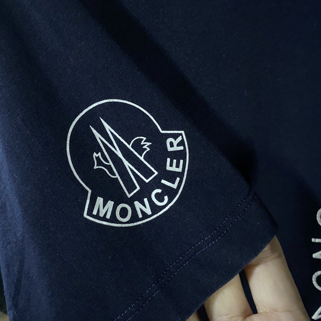 Moncler Shirt (Category: Tshirts & Polo Shirts ) located in Baguio. Submitted by goodfinds2600v2 (Listing ID 1461517937, Image 3). Description: Size on tag: XL fits M-L Dimensions: L-28 W/Bust-21.5 Description: unisex Condition: Very good Issue/s: print cracks, light discoloration on neckline .