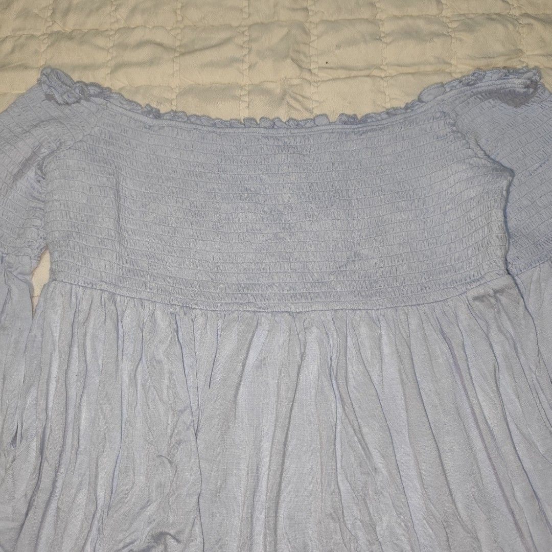 Mossimo Light Blue Smocked Off-the-Shoulder Top (Category: Others Tops) located in Bacolod City. Submitted by dearicawho.56 (Listing ID 1461477466, Image 3). Description: - Light blue off-the-shoulder top - Brand: Mossimo Supply Co. - Features: Smocked bodice, flowy bell sleeves - Material: Soft rayon and spandex blend - Versatile: Great for casual outings or nights with friends - Styling: Easily pairs with jeans or shorts 🧾Mode of payment: 💙Gc