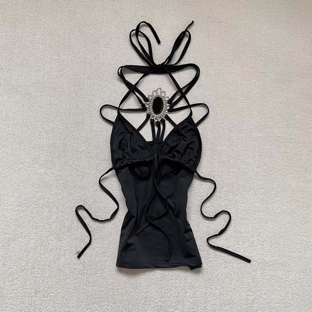 most unique whimsy black halter embellishment top with bra strings (Category: Sleeveless) located in Limay. Submitted by budolfindsrawrawr (Listing ID 1461518579, Image 1). Description: most unique whimsy black halter embellishment top with bra strings - fits s/m l13 b32-34 - in excellent condition .