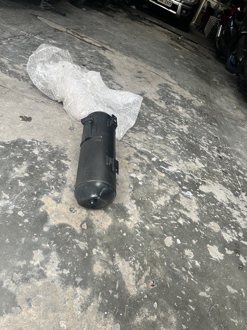 Motorcycle Exhaust Muffler Pipe (Category: Mufflers, Exhaust Parts & Accessories) located in Manila. Submitted by keanuchedi94156 (Listing ID 1461408774, Image 3). Description: - Black motorcycle exhaust muffler - Features a bent pipe design - Still fully functional and in working condition - Removed from a running motorcycle - Ready for its next owner.