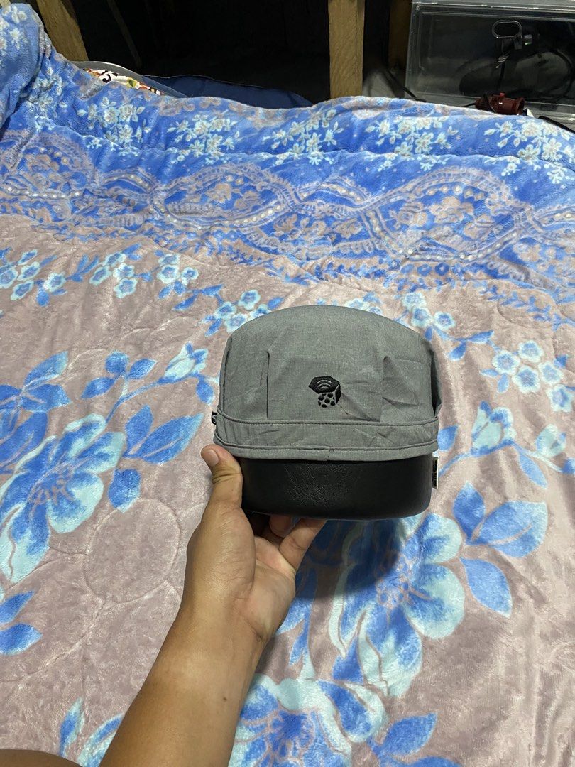 Mountain Hardwear Grey Cap Hat (Category: Caps & Hats) located in Polomolok. Submitted by marrssz (Listing ID 1461392449, Image 2). Description: - Mountain Hardwear grey cap - Maroon ribbon detail with button accent - Casual and outdoor style - Ideal for sunny days and hiking - Clear brand label inside.
