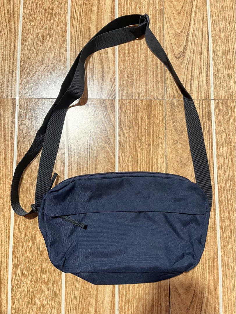 Muji navy blue sling bag (Category: Sling Bags) located in Lucena. Submitted by mjaothrift (Listing ID 1461416685, Image 1). Description: Muji Color navy blue Multi-pockets No issue, like new condition Unisex .