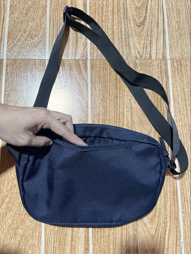 Muji navy blue sling bag (Category: Sling Bags) located in Lucena. Submitted by mjaothrift (Listing ID 1461416685, Image 2). Description: Muji Color navy blue Multi-pockets No issue, like new condition Unisex .