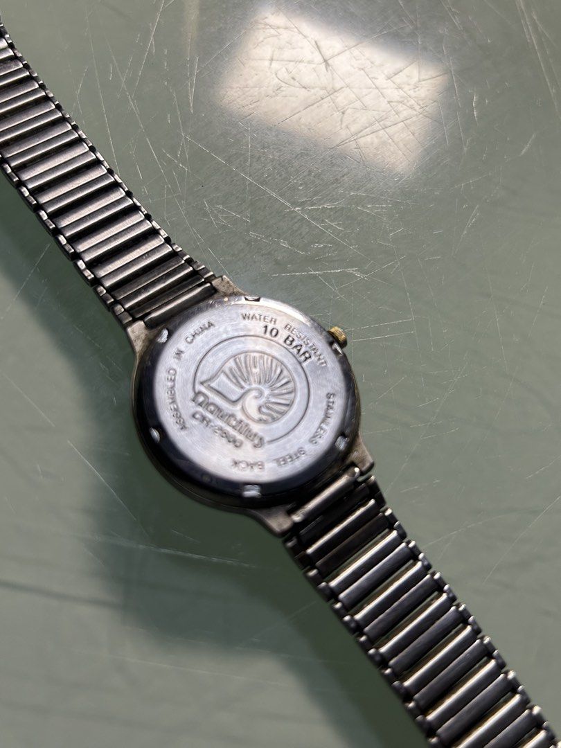 Nautilus Watch - Moon Phase - Water Resistant 10 Bar (Category: Women's Watches) located in Cavite. Submitted by mamamia73 (Listing ID 1461547652, Image 3). Description: Nautilus watch with moon phase. White dial, gold accents, stainless steel band. Water resistant 10 bar. Model DHT-2900. Assembled in China. Perfect for daily wear..
