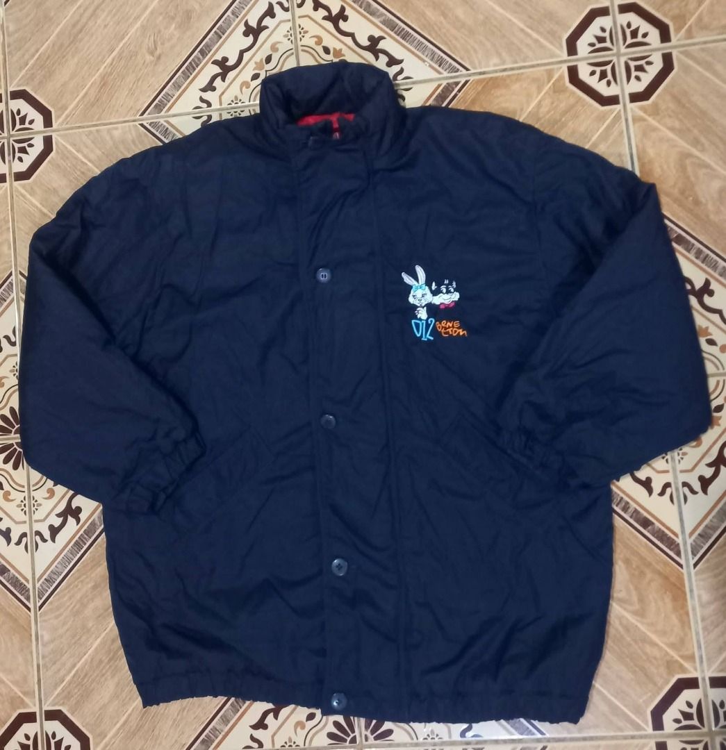 Navy Blue Cartoon Character Jacket (Category: Coats, Jackets and Outerwear) located in Baguio. Submitted by jonandaya (Listing ID 1461557658, Image 1). Description: - Navy blue jacket - Fun cartoon character graphic on chest - Button-up front - Red plaid lining inside - Elasticated cuffs - Ideal for casual wear -24x29 XL.