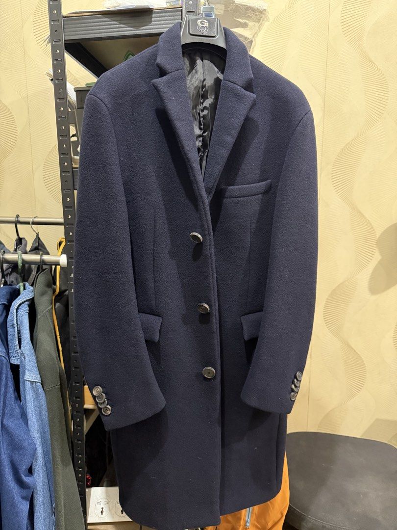 Navy Blue Wool Blend Overcoat (Category: Coats, Jackets and Outerwear) located in Manila. Submitted by derrickgua31823 (Listing ID 1461423568, Image 1). Description: Classic navy blue overcoat (unbranded) - Dimensions: shoulders - 19” length - 36” - Wool blend fabric good for winter travel - Single-breasted design with a 3-button closure - Includes two front pockets and one chest pocket - Button details on the cuffs - Fully lined interior for com