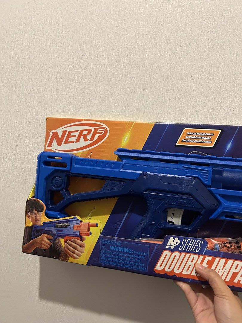 Nerf N-Strike Double Impact Blaster Toy Gun (Category: Action & Battle Toys) located in Taguig. Submitted by yujijaegerrrs (Listing ID 1461519898, Image 3). Description: PRICE IS NEGOTIABLE ✨ purpose of selling : for catfood I played this only once. - Pump action blasting toy gun - Comes in original packaging - Includes 12 darts .