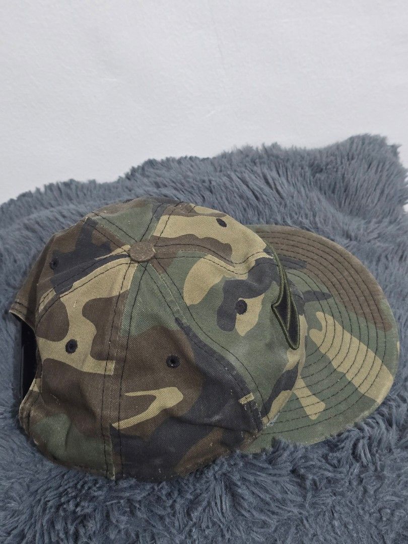 New Era Camo Snapback Cap (Category: Caps & Hats) located in Manila. Submitted by trialfindsmanila (Listing ID 1461504495, Image 2). Description: still in good condition, pakilabhan nalang. hindi masyado nagagamit. - Camo print snapback cap - Black embroidered logo on front - New Era branding on side - Adjustable snap closure - Classic baseball cap style.