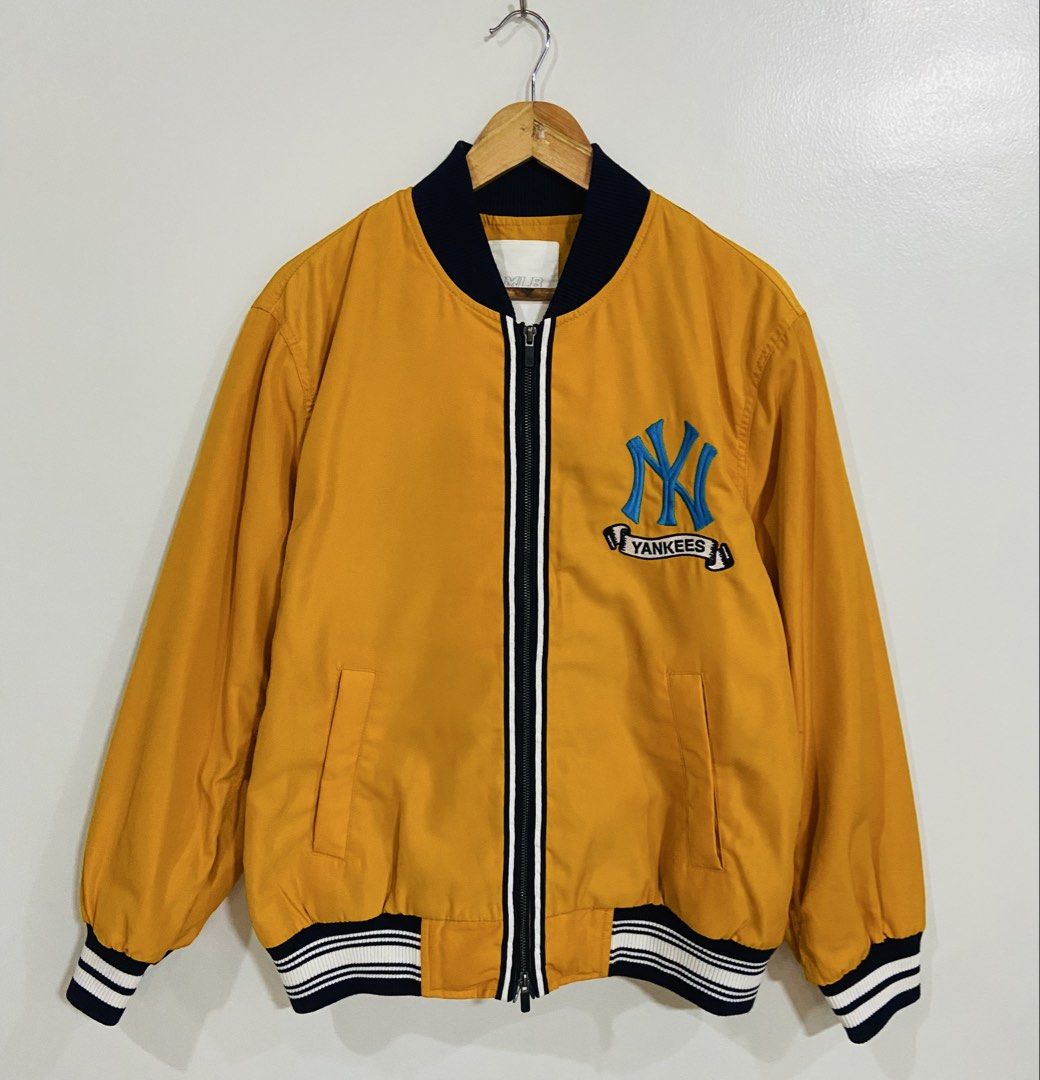 New York Yankees MLB Bomber Jacket Yellow (Category: Coats, Jackets and Outerwear) located in Manila. Submitted by thriftnijuan08 (Listing ID 1461344306, Image 1). Description: - Yellow bomber jacket - Official New York Yankees logo on front and back - Iconic NY logo on chest - 'Yankees' script on the back - Ribbed collar, cuffs, and hem for a snug fit - MLB branding on zipper pull - A must-have for any Yankees fan! -Dimes 23/26.
