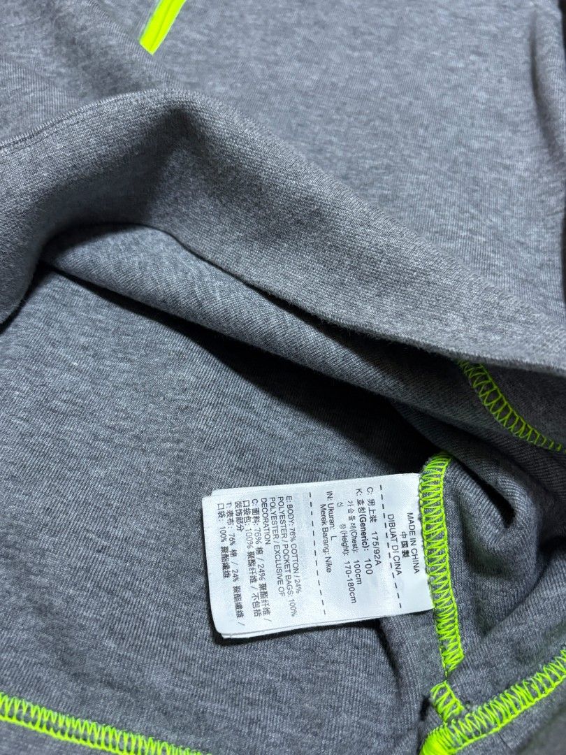 Nike (Category: Coats, Jackets and Outerwear) located in Caloocan City. Submitted by rheiven153 (Listing ID 1461492977, Image 3). Description: Color: Dark/Heather Grey with Volt/Neon Yellow accents and black panels Size: L (Large) — tag also indicates approx. 170–180 cm height / 100 cm chest Made in: China Style/Product code: 679405-091 Tag code: HO150509TWC / HO1505097WC UPC: 885179643735 Material: 76% cotton / 24% polyester; pocket bags 100% po