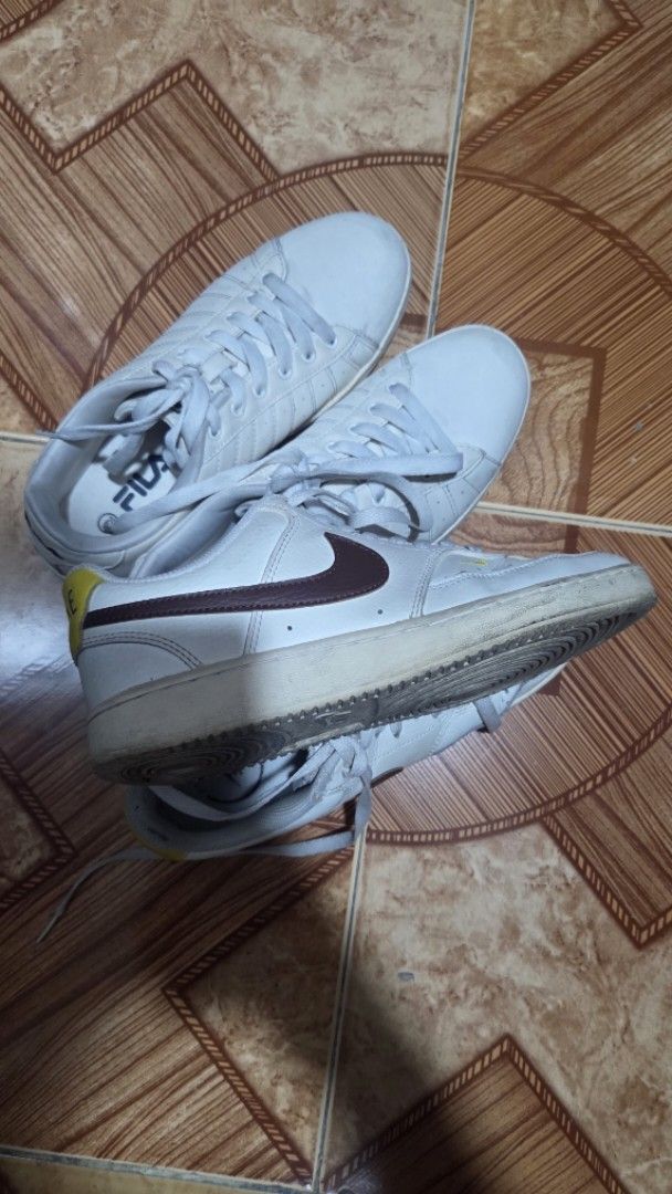 Nike & Fila Sneakers White (Category: Sneakers) located in Manila. Submitted by bernadette2207 (Listing ID 1461402029, Image 1). Description: Bundle of 2 pairs of white sneakers: Nike with brown swoosh and Fila with side logo. Both low-top lace-ups, perfect for casual wear..