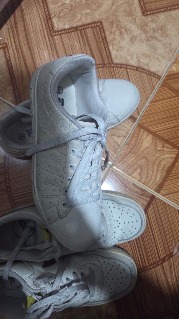 Nike & Fila Sneakers White (Category: Sneakers) located in Manila. Submitted by bernadette2207 (Listing ID 1461402029, Image 2). Description: Bundle of 2 pairs of white sneakers: Nike with brown swoosh and Fila with side logo. Both low-top lace-ups, perfect for casual wear..