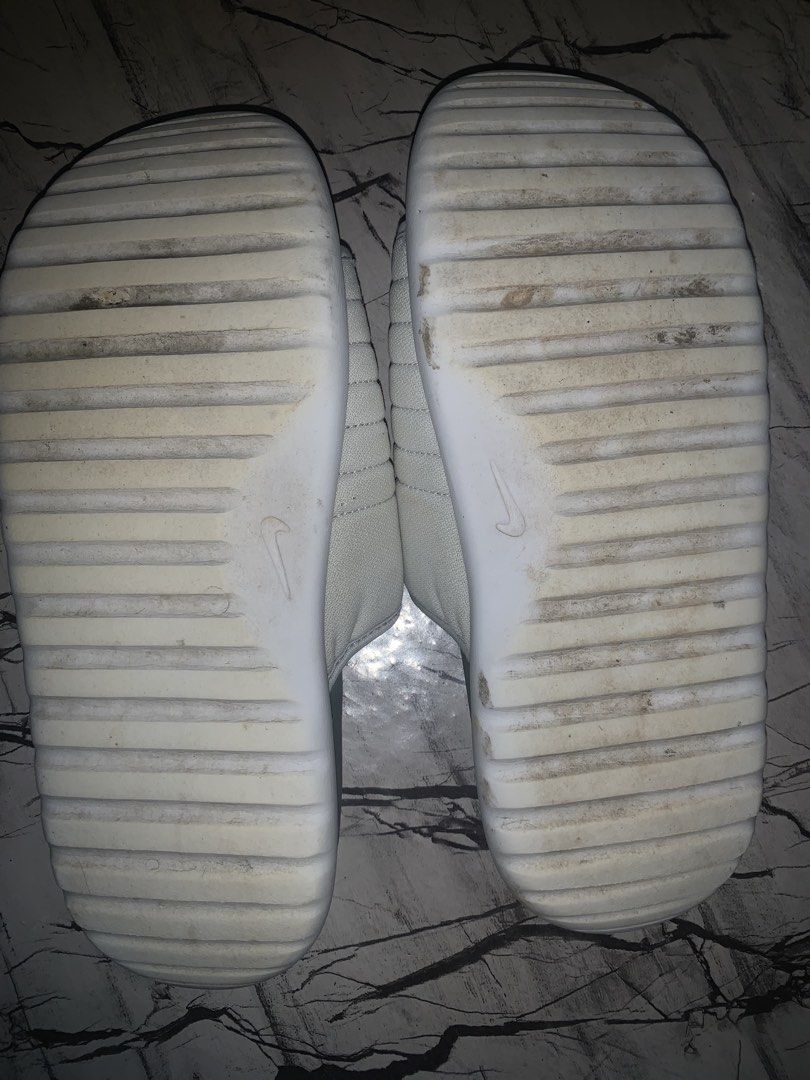 Nike Asuna 2 slides (Category: Slippers & Slides) located in San Mateo. Submitted by andiemoto (Listing ID 1461417046, Image 3). Description: - White Nike slides with grey soles - Adjustable strap closure - Size: US 8 / UK 7 / EUR 41 / CM 26 - Minor dirt on soles from normal wear - Ideal for casual wear.