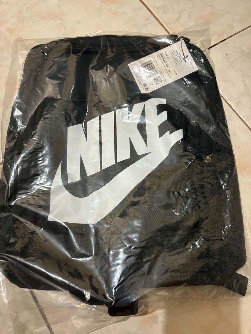 Nike Black Backpack with Large White Swoosh Logo (Category: Backpacks) located in Mandaluyong City. Submitted by annezoe (Listing ID 1461519866, Image 1). Description: -Brandnew and Legit💯 -Srp: 1,395 selling for only 650 - Classic black Nike backpack 16 L -2 pcs Available - Front zip pocket - Adjustable shoulder straps for comfort - Ideal for school, gym, or everyday use - Still in original packaging, with tags.