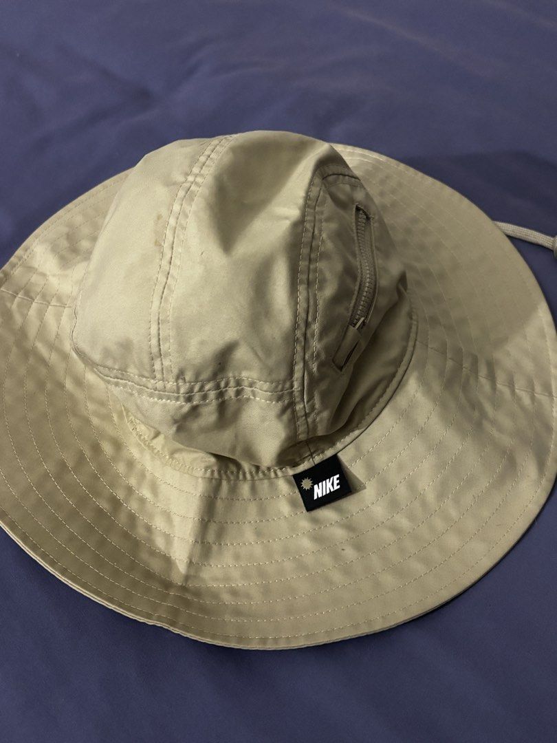 Nike Bucket Hat Khaki Size M (Category: Caps & Hats) located in Olongapo. Submitted by lovejeansph (Listing ID 1461362907, Image 2). Description: - Khaki Nike bucket hat - Size: Medium (M) - Convenient zip pocket on the crown - Adjustable chin strap with toggle for a secure fit - Ideal for outdoor adventures and casual wear.