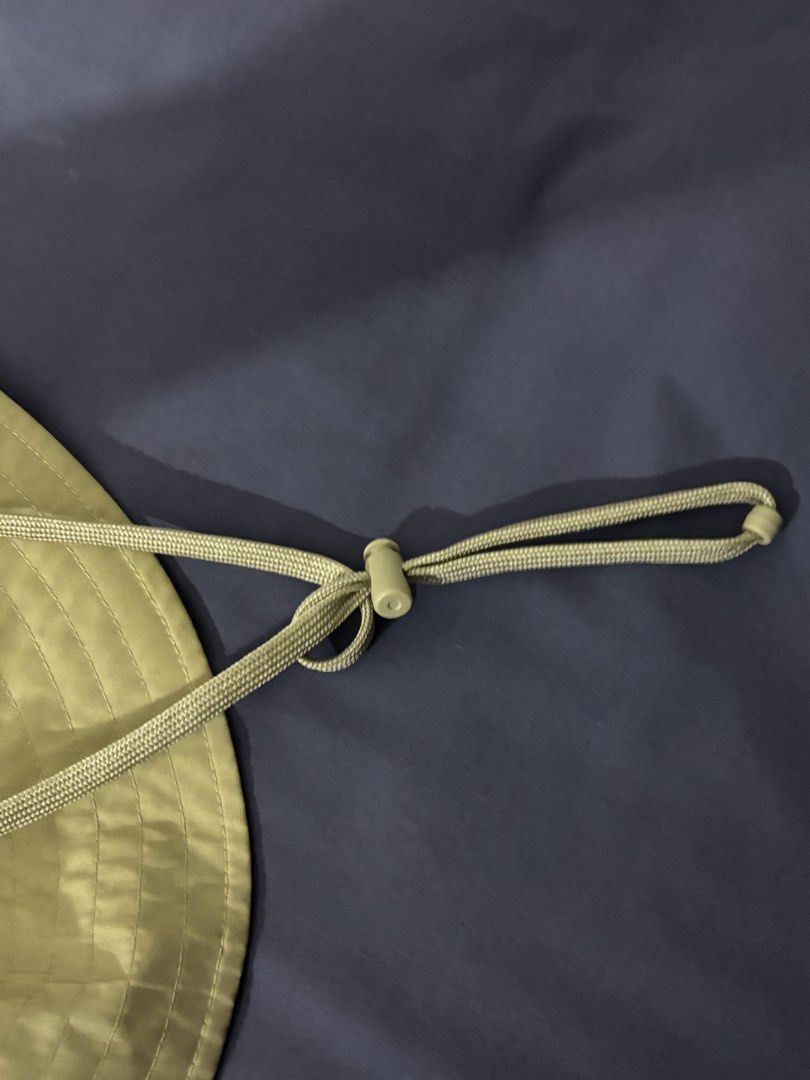 Nike Bucket Hat Khaki Size M (Category: Caps & Hats) located in Olongapo. Submitted by lovejeansph (Listing ID 1461362907, Image 3). Description: - Khaki Nike bucket hat - Size: Medium (M) - Convenient zip pocket on the crown - Adjustable chin strap with toggle for a secure fit - Ideal for outdoor adventures and casual wear.