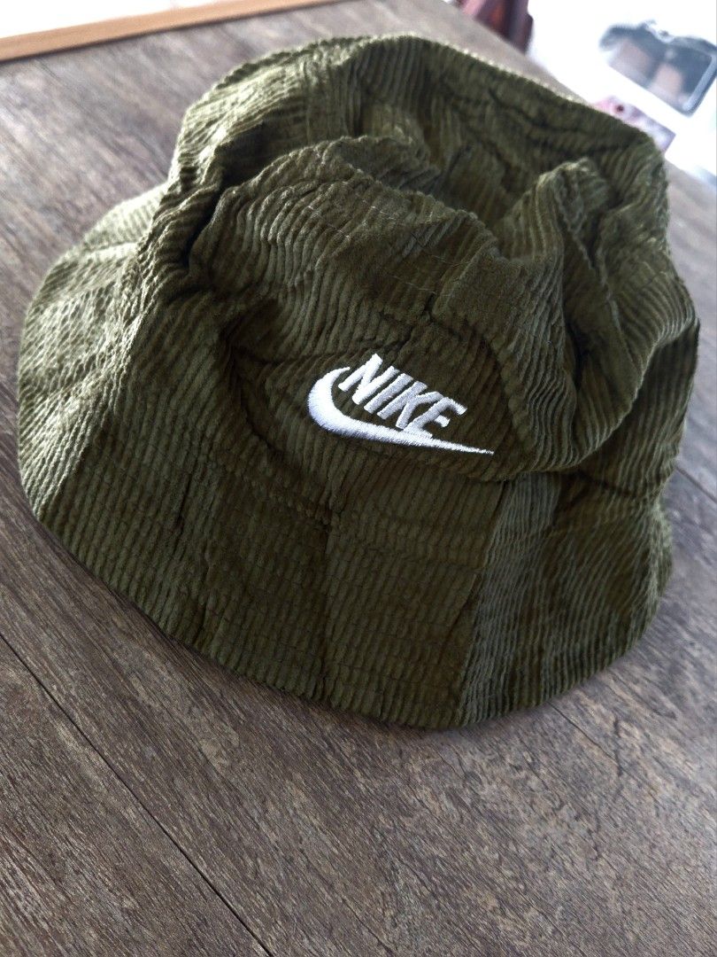 Nike Corduroy Cap - Olive Green (Category: Caps & Hats) located in Koronadal. Submitted by finlacenge48621 (Listing ID 1461324691, Image 1). Description: - Brand: Nike - Color: Olive Green - Material: Soft Corduroy - Feature: Embroidered Nike logo on front - Style: Casual, versatile.