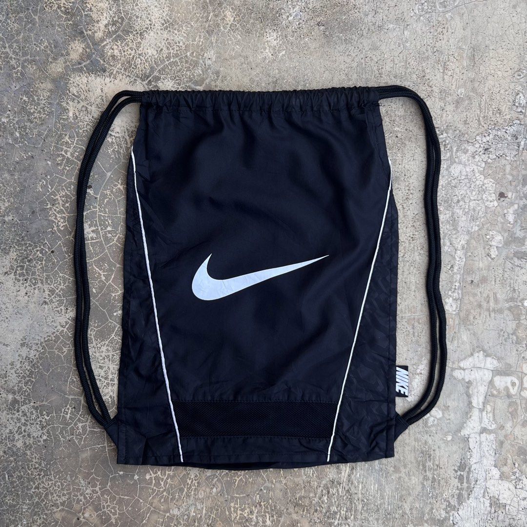 Nike Drawstring Backpack (Category: Backpacks) located in Kuala Terengganu. Submitted by sf11store (Listing ID 1461441189, Image 2). Description: Nike Drawstring Backpack Measurement 13 x 18.5 inch Used good 9/10 Dm for more details ✅.